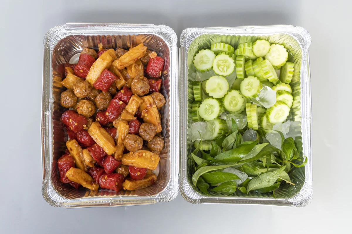 Meal prep boxes with meatballs, sweet potato and greens