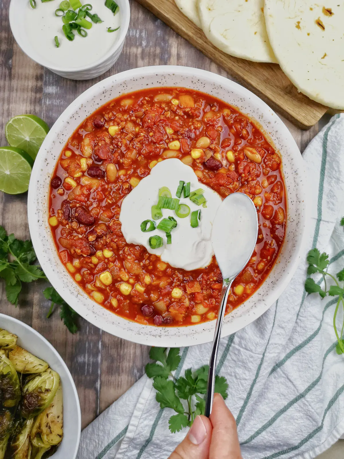 A bowl of bean chilli topped with sour cream